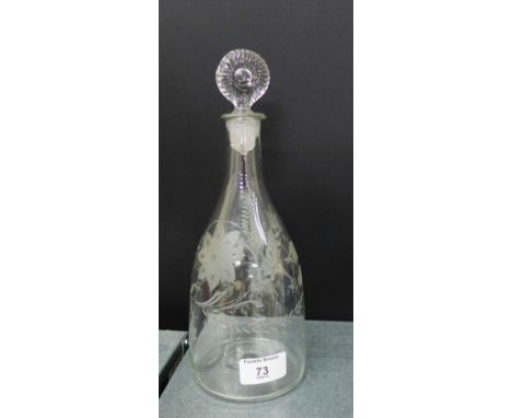 An etched glass decanter with bullseye stopper engraved with flowers, wheat and foliage and initials M.B, 27cm high