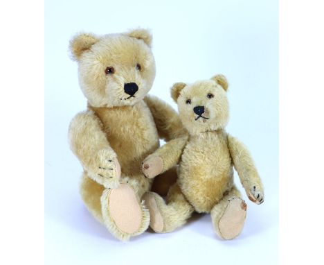 Two Steiff golden mohair Original Teddy bears, 1950s, both straw stuffed and with brown glass eyes, stitched noses and mouth,