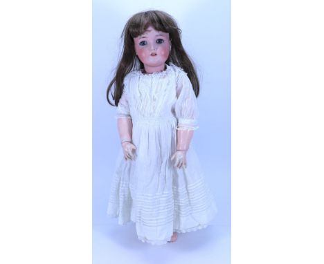 A large Kammer & Reinhardt/S&H bisque head doll, German circa 1915, with weighted blue glass eyes, painted brows, open mouth 