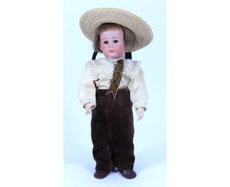 A sweet Kammer & Reinhardt 115 bisque head character doll, German circa 1910, with weighted brown glass eyes, painted brows a