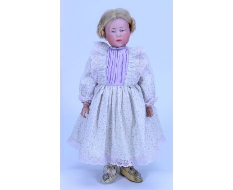 A Kammer & Reinhardt 101 bisque head character doll, German circa 1910, with painted light blue eyes, single stroke brows and