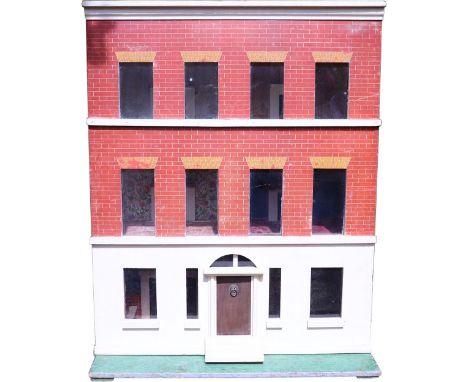 A large Silber & Fleming painted wooden dolls house on three levels, German 1890s, on a painted green base and with steps to 