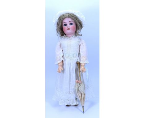 A large Kammer & Reinhardt/S & H bisque head ‘walker’ doll, German circa 1910, with weighted blue glass eyes, painted brows, 