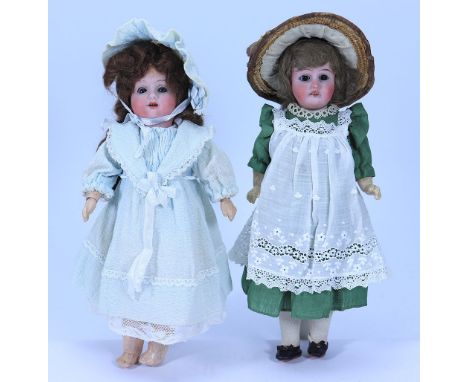 Two small bisque head dolls, German circa 1920, including all original girl with weighted blue glass eyes, open mouth and bro