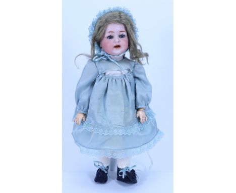 A Kammer & Reinhardt 122 bisque head character doll, German circa 1910, with weighted blue glass eyes, painted brows, open mo