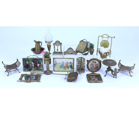 Collection of gold painted soft metal Dolls House miniatures, German 19th century, including two mantle clocks one with pendu