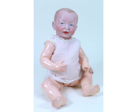 A Kammer & Reinhardt 100 ‘Kaiser’ bisque head character baby, German circa 1910, the heavily moulded face with painted blue e