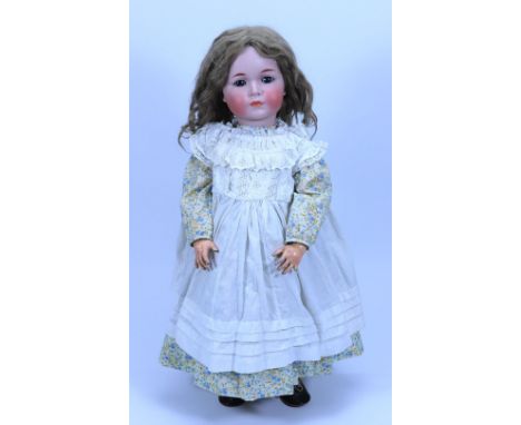 A Kammer & Reinhardt 117 bisque head character doll, German circa 1910, with weighted blue glass eyes, feather brows and clos