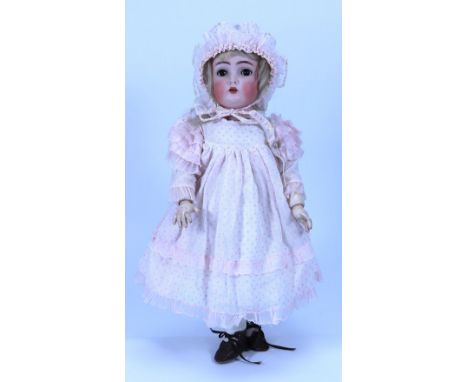 A Kammer & Reinhardt 403 bisque head girl doll, German circa 1910, with weighted brown glass eyes, painted brows, open mouth 