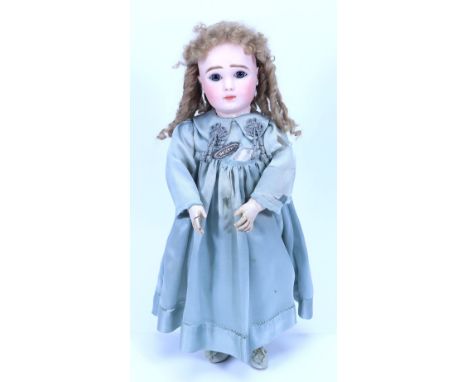 A figure A bisque head Steiner Bebe bisque head doll, size 11, French circa 1890, with good pale complexion fixed blue glass 