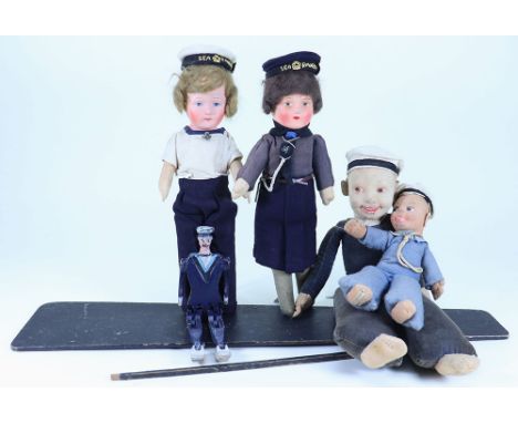 A painted wooden Sailor Dancing Jigger doll and four Sailor dolls, 1930s, the painted Sailor Jigger jointed at shoulders, hip