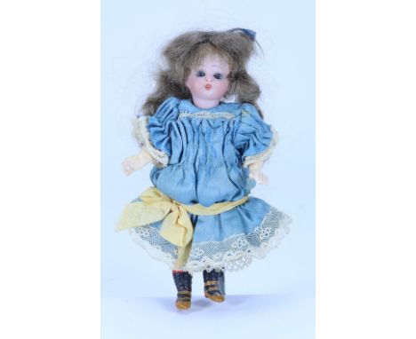 A miniature all original Simon & Halbig bisque head doll, German circa 1910, with weighted blue glass eyes, single stroke bro