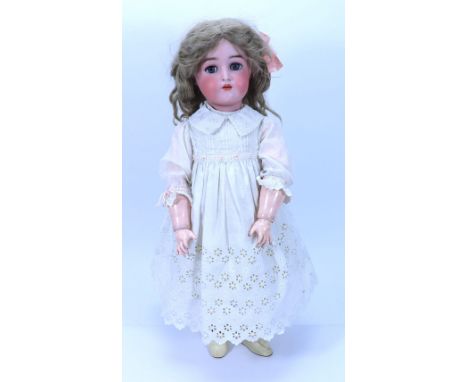 A Kammer & Reinhardt/S&H  bisque head doll, German circa 1915, with weighted blue glass eyes, painted brows, open mouth with 