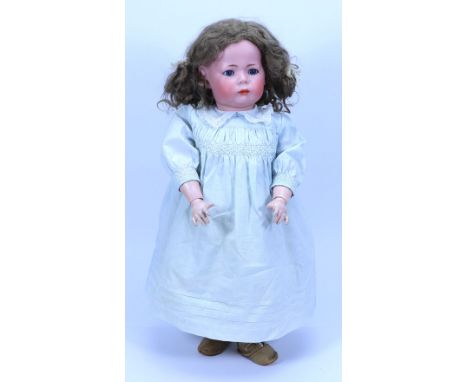 A large Kammer & Reinhardt 115A bisque head character doll, circa 1910, with weighted blue glass eyes, painted brows and clos