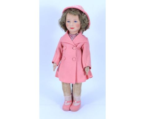 A Chad Valley Princess Elizabeth cloth doll, English circa 1935, the pressed, moulded felt head with blue glass eyes, painted