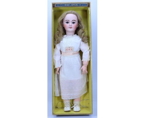 A large Tete Jumeau S.F.B.J 301 bisque head doll in original Jumeau box, size 13, French circa 1910, with weighted blue glass