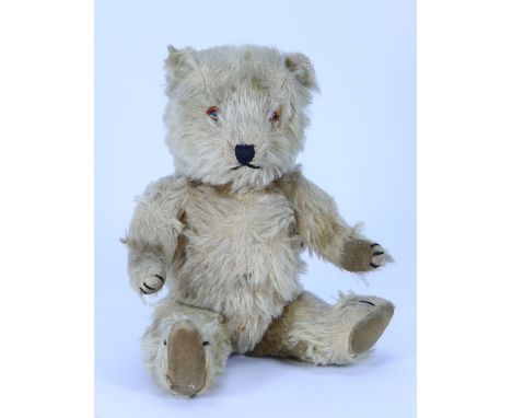 A charming post-war Chiltern Hugmee mohair Teddy bear, the golden mohair bear with orange glass eyes, black stitched nose and