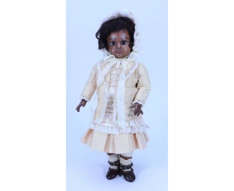 A rare Steiner figure A black Bebe bisque head doll, size 5, French circa 1890, with fixed brown glass paper-weight eyes, fea