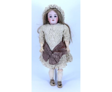 A Handwerck 109 bisque head doll, German circa 1910, with weighted blue glass eyes, open mouth and upper teeth, pierced ears,