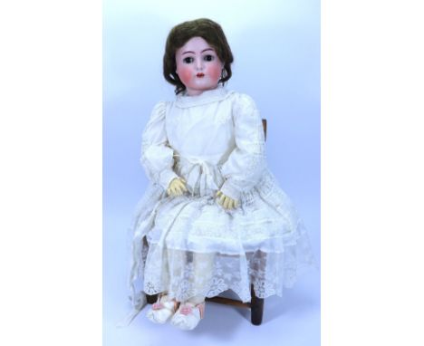 A large Kammer & Reinhardt/S&H bisque head doll, German circa 1915, with weighted brown glass eyes, painted brows, open mouth