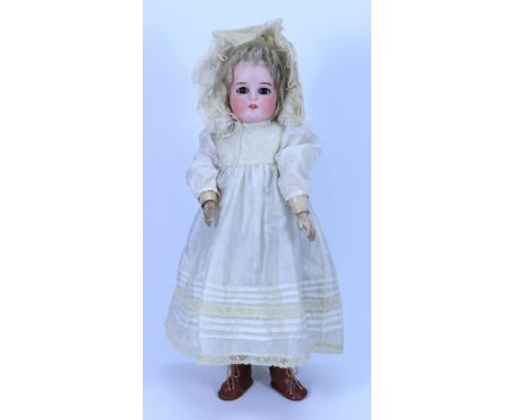 A Kammer & Reinhardt 191 bisque head doll, German circa 1910, with weighted brown glass eyes, open mouth with upper teeth, bl