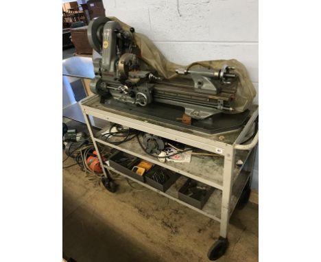 A Myford lathe on stand and various tools