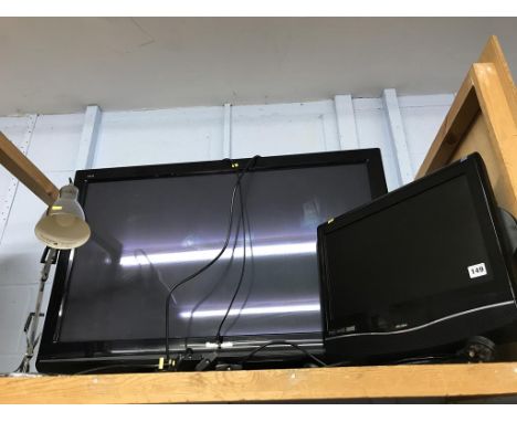 Two TVs and a lamp