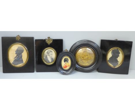 A pair of framed silhouettes, one painted silhouette, a framed portrait print and a framed plaque 