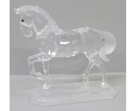 A Swarovski model of a horse, boxed and with leaflet 