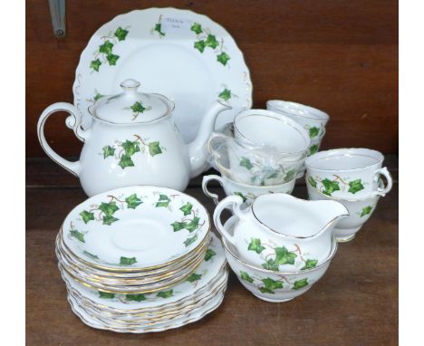 A Colclough six setting tea service, six saucers, plates, five cups, one a/f, two similar cups, sugar, cream and teapot 