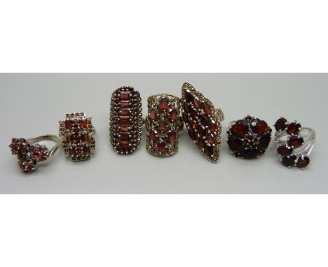 Seven large silver, garnet and marcasite rings, 80g, sizes N, O, P and R 