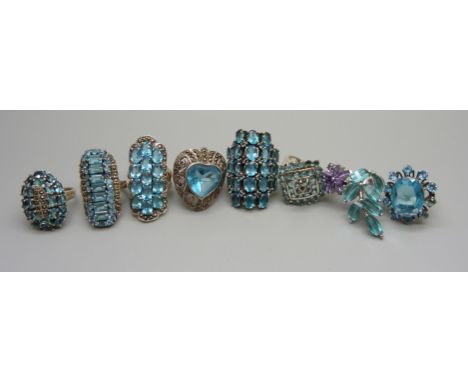 Eight large silver, marcasite and blue paste rings, 100.5g, sizes from O to R 