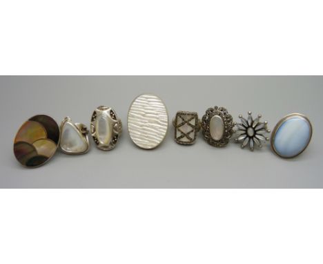 Eight large silver and mother of pearl rings, 96.3g,  sizes N, O, Q and R 