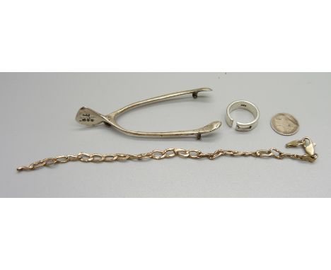 A 9ct gold bracelet, a/f, 2.8g, a silver ring, a silver wishbone brooch, a/f, and a 3d coin 