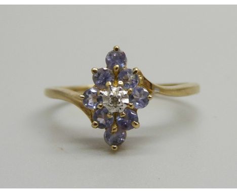 A 9ct gold, diamond and eight purple stone cluster ring, 1.9g, P 