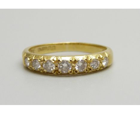 An 18ct gold, seven stone diamond ring, 2.8g, M 