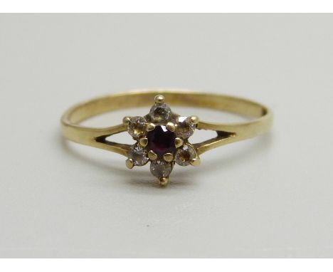 A 9ct gold, garnet and white stone cluster ring, 1.1g, N 