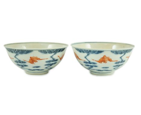 A pair of Chinese iron red and underglaze blue ‘five bat’ bowls, Guangxu mark and probably of the period (1875-1908), each wi