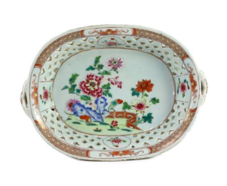 A Chinese famille rose oval two handled basket, Qianlong period, the interior painted with peonies, rockwork and a fence, cel