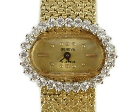 A lady's modern Swiss 14k gold and diamond set manual wind oval wrist watch, on integral 14k gold bracelet, case diameter 23m