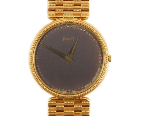 A gentleman's 18ct gold Piaget manual wind dress wrist watch, on an 18ct  gold Piaget bracelet, the blind dial with beaded bo