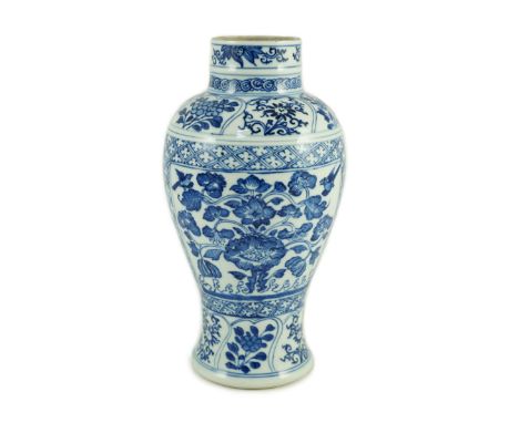 A Chinese blue and white vase, Kangxi period, painted with birds amid flowers and rockwork, within floral and diaper borders,