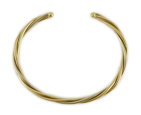 A modern Cartier 18k gold spiral twist open work bangle, signed and numbered 107998, 15 grams.**CONDITION REPORT**Minor surfa