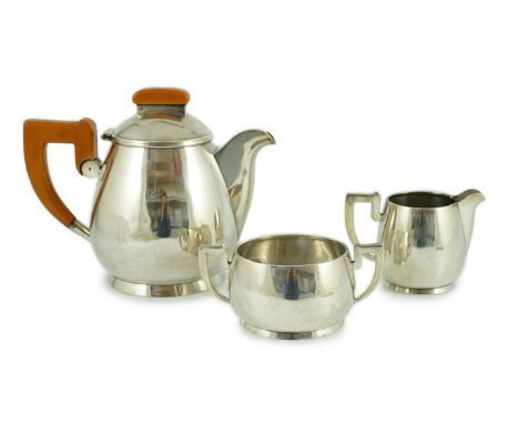 A stylish George VI silver three piece tea set, by Ls Sl, with bakelite handles, London, 1947, gross weight 45oz.**CONDITION 