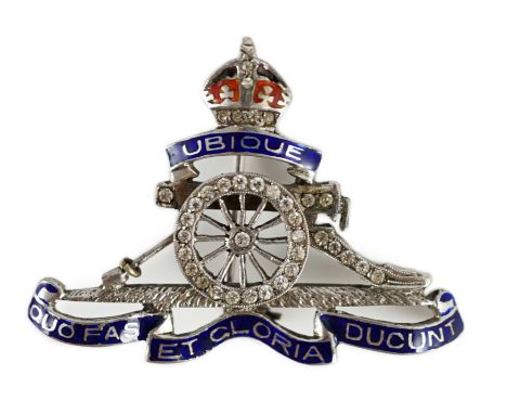 A white gold two colour enamel and diamond chip set Royal Artillery sweethearts brooch, 4cm, gross weight 6.9 grams.**CONDITI