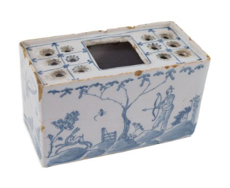 An English delftware flower brick, mid 18th century, painted with Chinese figures in European landscapes, 14.5cm wide, chips 