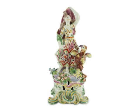 A large Bow porcelain group of Juno, c.1760-65, emblematic of air, the figure standing beside an eagle or vulture on a flower