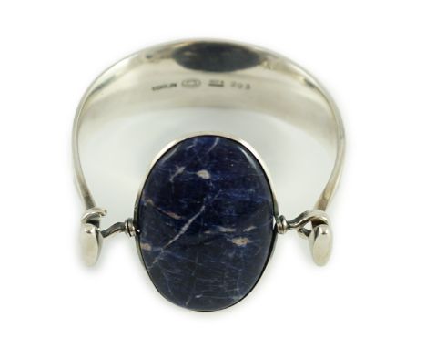 A Vivianna Torun for Georg Jensen sterling silver and oval cabochon lapis lazuli set bangle, numbered 203, interior diameter 