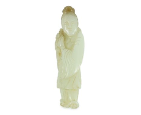 A Chinese pale celadon jade figure of a lady, possibly He Xiangu, 19th century, the carver skilfully using a brown inclusion 