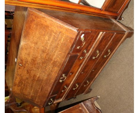 A George III oak bureau on bracket feet
